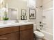 Bright bathroom featuring a modern vanity, ample lighting, and shower, creating a clean and functional space at 18231 W Soft Wind Dr, Surprise, AZ 85387