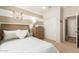 Cozy bedroom with striped accent wall, a white closet door and natural light, creating a comfortable living space at 18231 W Soft Wind Dr, Surprise, AZ 85387