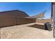 Low maintenance backyard featuring a shade sail and gravel landscaping at 18319 W Marshall Ave, Litchfield Park, AZ 85340