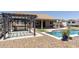 A backyard featuring a gazebo, covered patio, pool, and outdoor bar area offers relaxation and entertainment at 18319 W Marshall Ave, Litchfield Park, AZ 85340