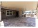 Covered patio with an outdoor kitchen area and sliding glass door for convenient indoor-outdoor living at 18319 W Marshall Ave, Litchfield Park, AZ 85340