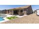 Backyard featuring a gazebo, covered patio, outdoor grill, and recreational vehicle in a well-designed space at 18319 W Marshall Ave, Litchfield Park, AZ 85340