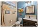 Stylish half bath featuring a decorative sink and colorful wall art at 18319 W Marshall Ave, Litchfield Park, AZ 85340