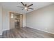 Bedroom with wood floors and barn doors to an office nook at 18319 W Marshall Ave, Litchfield Park, AZ 85340