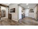 Inviting entryway featuring wood-look floors, and a striking accent wall, creating a warm and stylish first impression at 18319 W Marshall Ave, Litchfield Park, AZ 85340