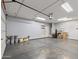 Spacious garage with epoxy flooring, ample lighting, and garage door opener at 18319 W Marshall Ave, Litchfield Park, AZ 85340