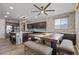 Modern kitchen featuring dark wood cabinets, stainless steel appliances, and a large island with bar seating at 18319 W Marshall Ave, Litchfield Park, AZ 85340