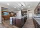 Open kitchen with a large center island, stainless steel appliances, and views into a Gathering room at 18319 W Marshall Ave, Litchfield Park, AZ 85340