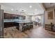 Bright open-concept kitchen features a large island, stainless steel appliances, and an adjoining dining space at 18319 W Marshall Ave, Litchfield Park, AZ 85340