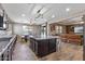 Bright, open kitchen featuring stainless steel appliances, a center island, and seamless access to the living area at 18319 W Marshall Ave, Litchfield Park, AZ 85340