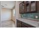Elegant kitchenette featuring sleek granite countertops, stylish cabinetry, and a bright, airy ambiance with modern finishes at 18319 W Marshall Ave, Litchfield Park, AZ 85340