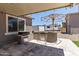 Backyard with a built-in outdoor grill and bar area at 18319 W Marshall Ave, Litchfield Park, AZ 85340