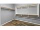 Walk-in closet with ample storage shelving and wood floors at 18319 W Marshall Ave, Litchfield Park, AZ 85340