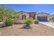 Single-story home with desert landscaping, offering low maintenance and attractive curb appeal at 189 N Rainbow Way, Casa Grande, AZ 85194