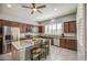 Bright kitchen featuring custom cabinets, granite countertops, and stainless steel appliances at 189 N Rainbow Way, Casa Grande, AZ 85194