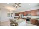 Open kitchen featuring an island, pendant lighting, stainless steel appliances, and ample cabinetry at 189 N Rainbow Way, Casa Grande, AZ 85194