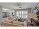 Open-concept living room connected to the kitchen, with tile floors and ample seating at 189 N Rainbow Way, Casa Grande, AZ 85194