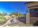 Outdoor patio with desert views, features a decorative fountain and comfortable seating area at 189 N Rainbow Way, Casa Grande, AZ 85194