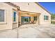 Covered patio with ceiling fan and sliding door access to the home's interior at 189 N Rainbow Way, Casa Grande, AZ 85194