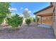 A charming backyard with desert landscaping and a covered patio at 19321 N Tara Lane Ln, Maricopa, AZ 85138