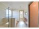 This bathroom features a glass shower, tile floors, and neutral walls at 19321 N Tara Lane Ln, Maricopa, AZ 85138