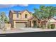 Two-story home with a two-car garage, solar panels, and a well-maintained front yard at 19321 N Tara Lane Ln, Maricopa, AZ 85138