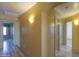 Hallway with wood floors and multiple doors leading to different rooms at 19321 N Tara Lane Ln, Maricopa, AZ 85138