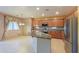 Open-concept kitchen with a center island, stainless steel appliances, and tile backsplash at 19321 N Tara Lane Ln, Maricopa, AZ 85138