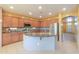 Kitchen with a center island, stainless steel appliances, and ample cabinetry space at 19321 N Tara Lane Ln, Maricopa, AZ 85138