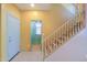 Entryway featuring a staircase, access to a half-bathroom, and outside access at 19321 N Tara Lane Ln, Maricopa, AZ 85138