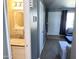 Bathroom with white vanity and mirror near entry to living area at 19601 N 7Th St Ave # 1036, Phoenix, AZ 85024