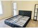 Bedroom with carpet and black platform bed frame at 19601 N 7Th St Ave # 1036, Phoenix, AZ 85024