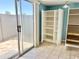 Bonus room includes tile flooring and a sliding glass door providing natural light and access to a patio at 19601 N 7Th St Ave # 1036, Phoenix, AZ 85024