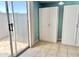Bonus room includes tile flooring and a sliding glass door providing natural light and access to a patio at 19601 N 7Th St Ave # 1036, Phoenix, AZ 85024