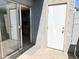Back patio featuring stone-style flooring accessible from the kitchen and doorway to the utility room at 19601 N 7Th St Ave # 1036, Phoenix, AZ 85024