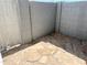 Private outdoor patio area with stone flooring and block wall creating a cozy outdoor space at 19601 N 7Th St Ave # 1036, Phoenix, AZ 85024