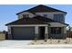 Charming two-story home with a two-car garage and neatly manicured landscaping at 20645 N 226Th Ln, Surprise, AZ 85387