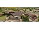 Expansive backyard featuring a pool, covered patio, hot tub and lush landscaping at 21131 E Excelsior Ave, Queen Creek, AZ 85142
