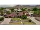 Expansive single-story home featuring mature trees, lush landscaping and mountain views at 21131 E Excelsior Ave, Queen Creek, AZ 85142