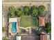Aerial view of a backyard with a pool, lush lawn, and covered lounge area at 21131 E Excelsior Ave, Queen Creek, AZ 85142