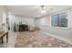 Finished basement with a large rug, window, and staircase leading to another level at 21131 E Excelsior Ave, Queen Creek, AZ 85142