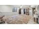 The basement features a decorative rug and a display cabinet, offering ample space at 21131 E Excelsior Ave, Queen Creek, AZ 85142