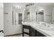 Bathroom boasts a double vanity with white tile countertops and large mirror at 21131 E Excelsior Ave, Queen Creek, AZ 85142