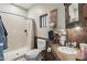 Rustic bathroom featuring a walk-in shower, wood vanity, and decorative accents for a cozy and inviting space at 21131 E Excelsior Ave, Queen Creek, AZ 85142
