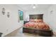 Cozy bedroom features a large bed, window, and bedside table for comfort at 21131 E Excelsior Ave, Queen Creek, AZ 85142