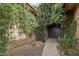 Lush landscaping surrounds the entryway of this charming single-story home at 21131 E Excelsior Ave, Queen Creek, AZ 85142