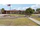 Single-story home showcasing mature trees, lush landscaping, and a charming walkway leading to the entrance at 21131 E Excelsior Ave, Queen Creek, AZ 85142
