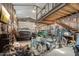 The large garage holds cars, bikes, and more, complete with overhead storage at 21131 E Excelsior Ave, Queen Creek, AZ 85142