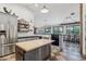 Bright kitchen boasts a butcher block island with metal accents and views to the adjacent breakfast nook at 21131 E Excelsior Ave, Queen Creek, AZ 85142