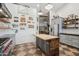 Modern kitchen features a large island, stainless steel appliances, and ample counter space with open shelving at 21131 E Excelsior Ave, Queen Creek, AZ 85142